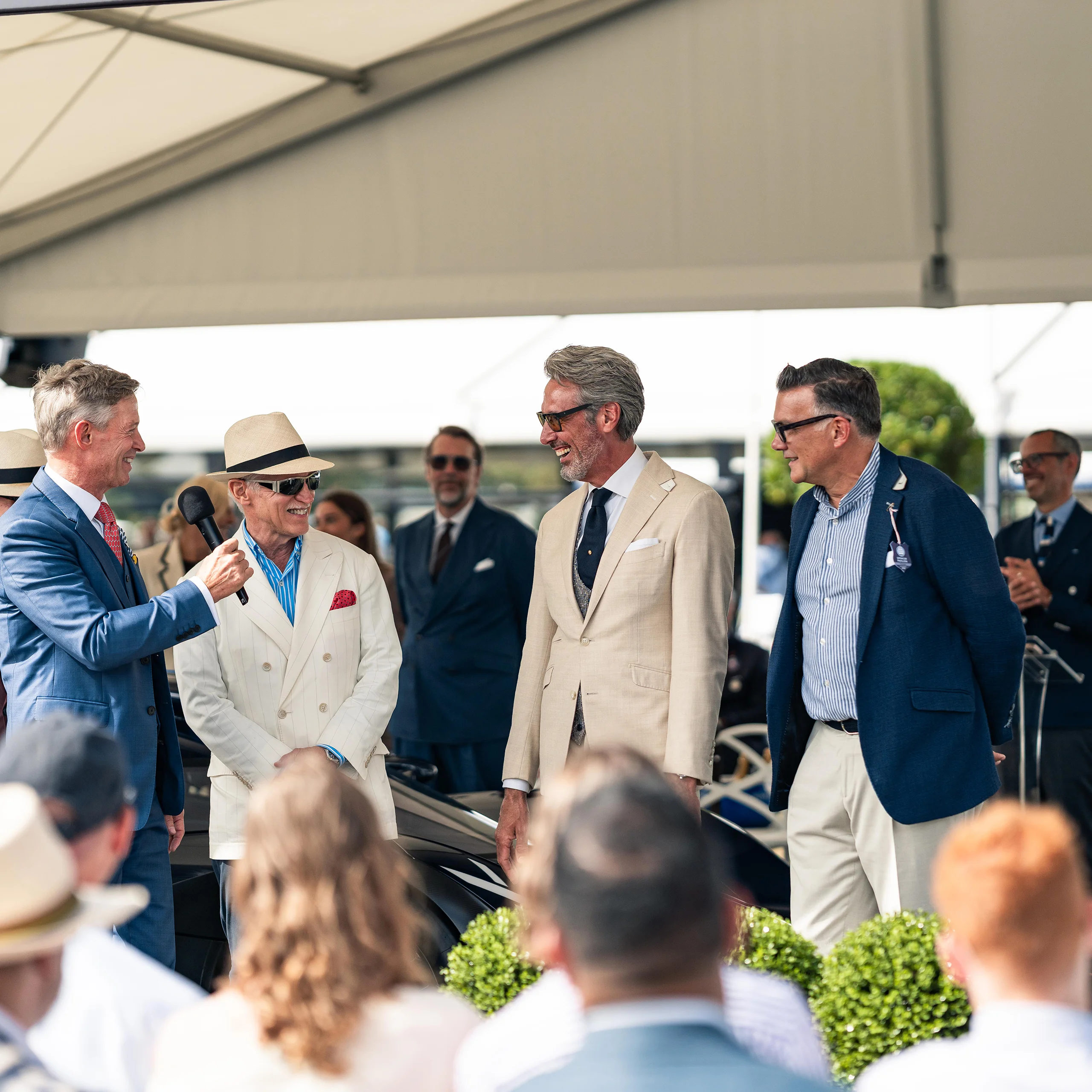 Group of guests in tailoring at the Clements and Church Salon Privé stand