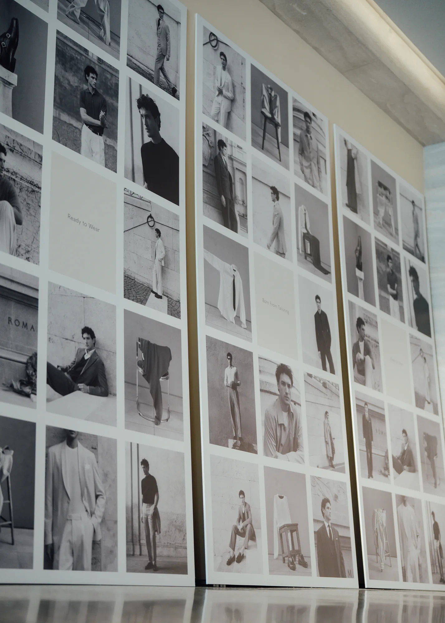 Black and white Clements and Church lookbook prints displayed on panels at the Albemarle Street pop-up