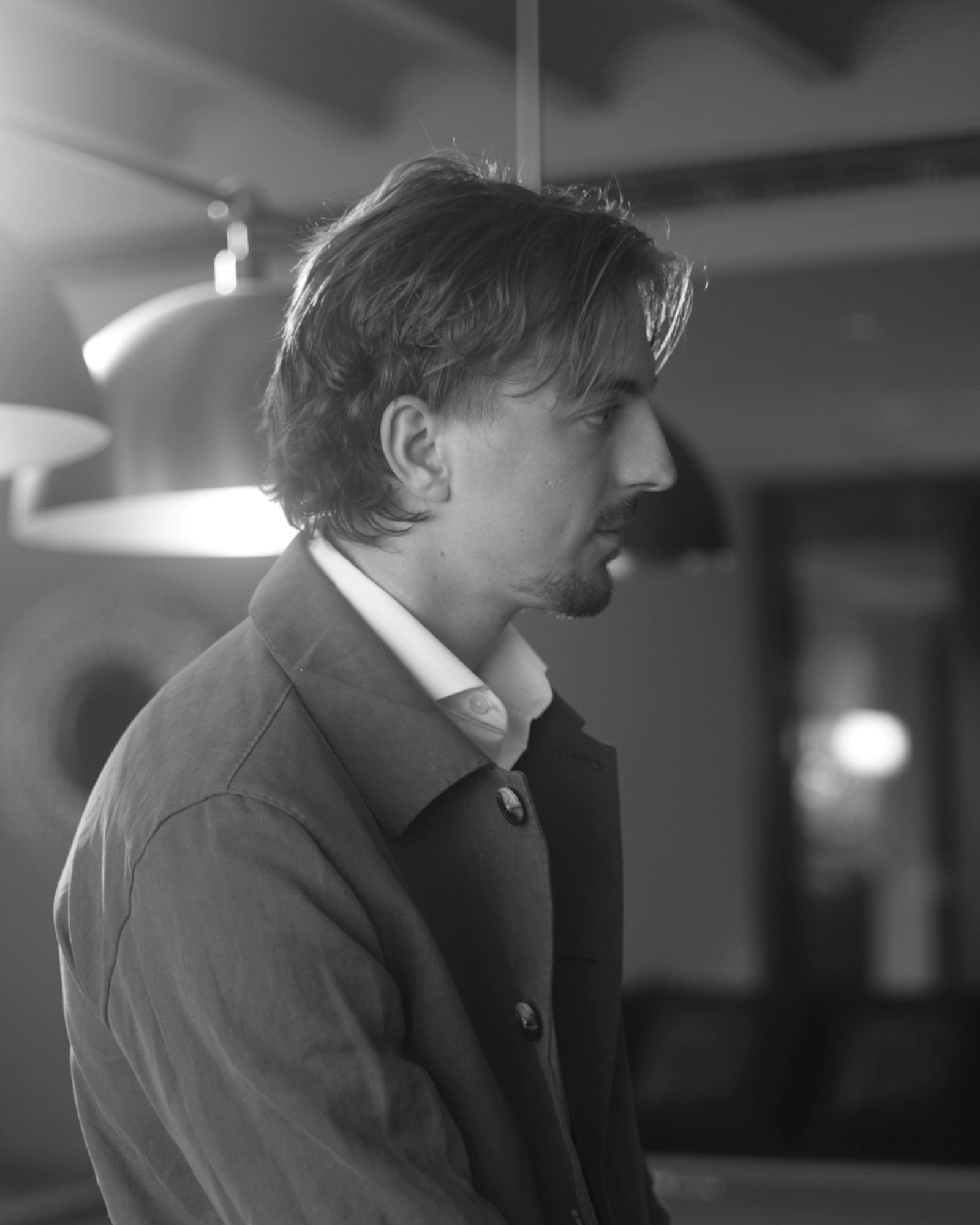 Harry Clements, Dubai Tailor, in a dark overshirt and open-collar shirt