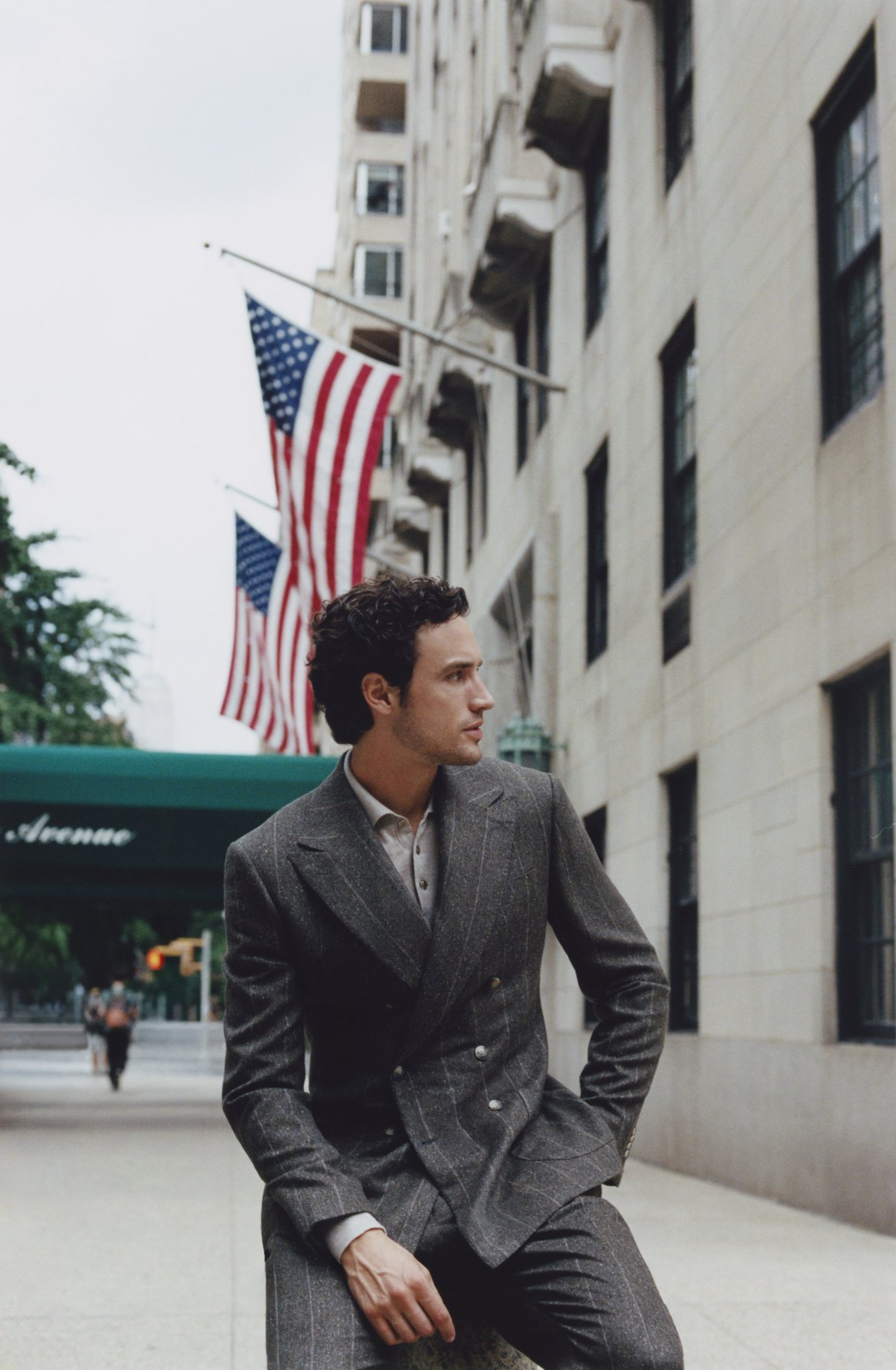 Man in a custom made green pinstripe double-breasted suit on Fifth Avenue, New York